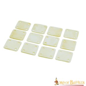 Square bone tablet weaving cards with four corner holes arranged in a set.